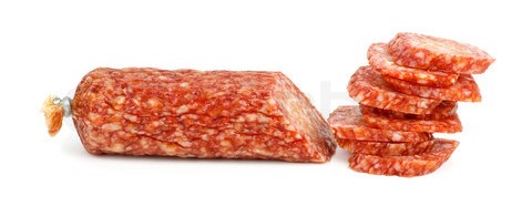 Half of salami sausage and pile of slices near